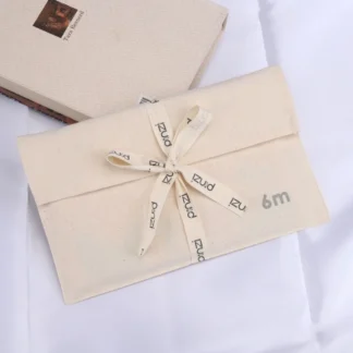 Producto personalizado, sobre de algodón orgánico impreso con logotipo personalizado, almohada de lona, bolsa de embalaje de ropa para niños con corbata, sobre de algodón