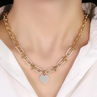 Moda personalidad temperamento viento frío Vachette cierre corazón colgante delicado collar pulsera chapado en oro conjunto joyería de circón
