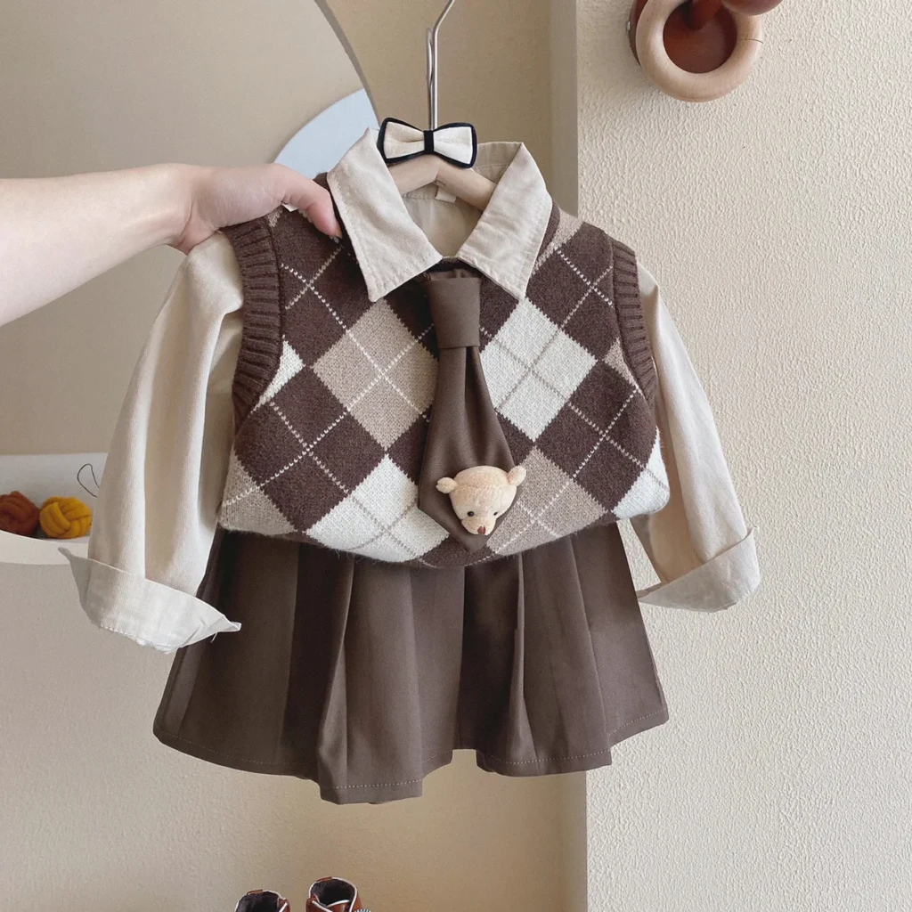 Conjunto de ropa de estilo universitario para niñas, camisas de algodón, chaleco de punto Argyle, faldas plisadas, traje para niñas pequeñas, otoño 2025