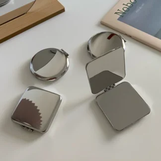 Espejo de maquillaje de doble cara de acero inoxidable Simple y portátil Ins, espejo de tocador plegable de bolsillo de mano, accesorios de maquillaje de belleza