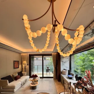 Candelabro de mármol perla de diseño americano con piedra española importada, forma redonda, latón, acabado en níquel negro, función regulable